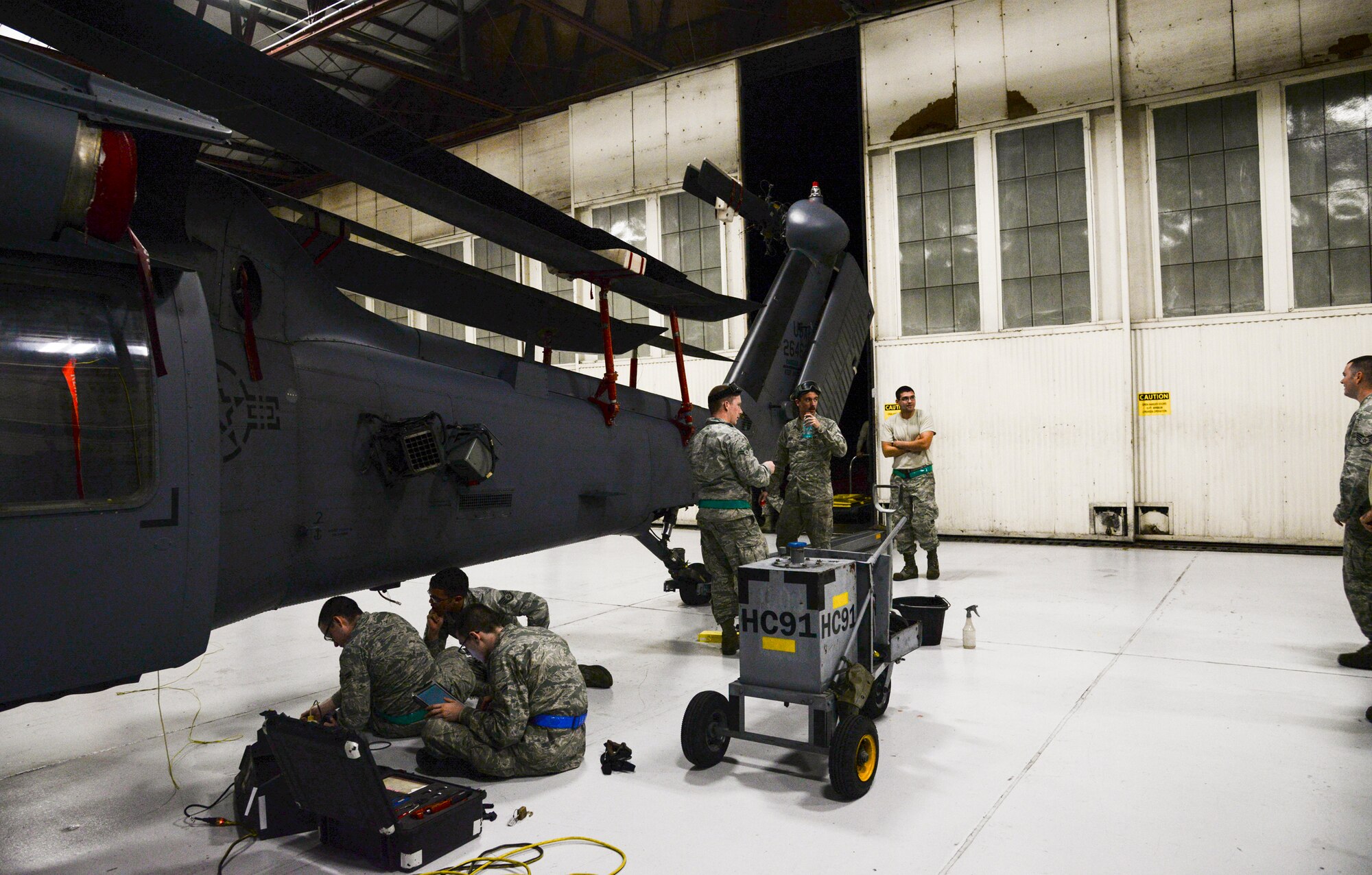 Members of the 723d Aircraft Maintenance Squadron prepare an HH-60G Pave for transport during a Wing Readiness Inspection, Jan. 14, 2014 at Moody Air Force Base, Ga. The Air Force recently shifted from Operational Readiness Exercises to Wing Readiness Inspections, designed to better reflect real-world scenarios. (U.S. Air Force photo by Airman 1st Class Sandra Marrero/Released)
