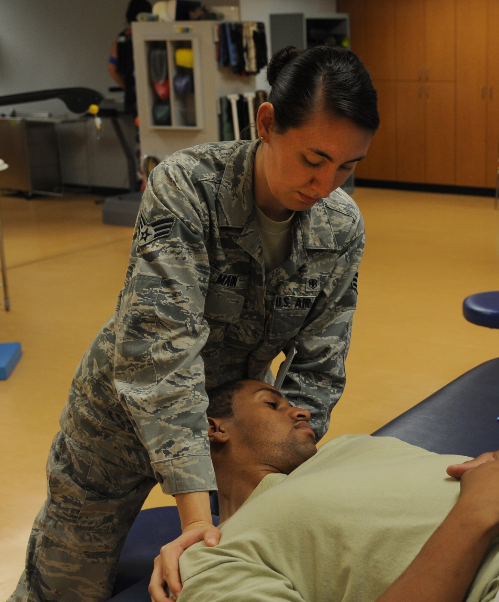 Senior Airman Jordan Main, a 19th Medical Operations Squadron physical therapy technician adjusts a patient to improve movement and manage pain Oct. 1 at Little Rock Air Force Base. Main revamped and standardized the section’s job analysis, resulting in her program being benchmarked by 41 safety representatives across the group. (U.S. Air Force photo by Airman 1st Class Harry Brexel)