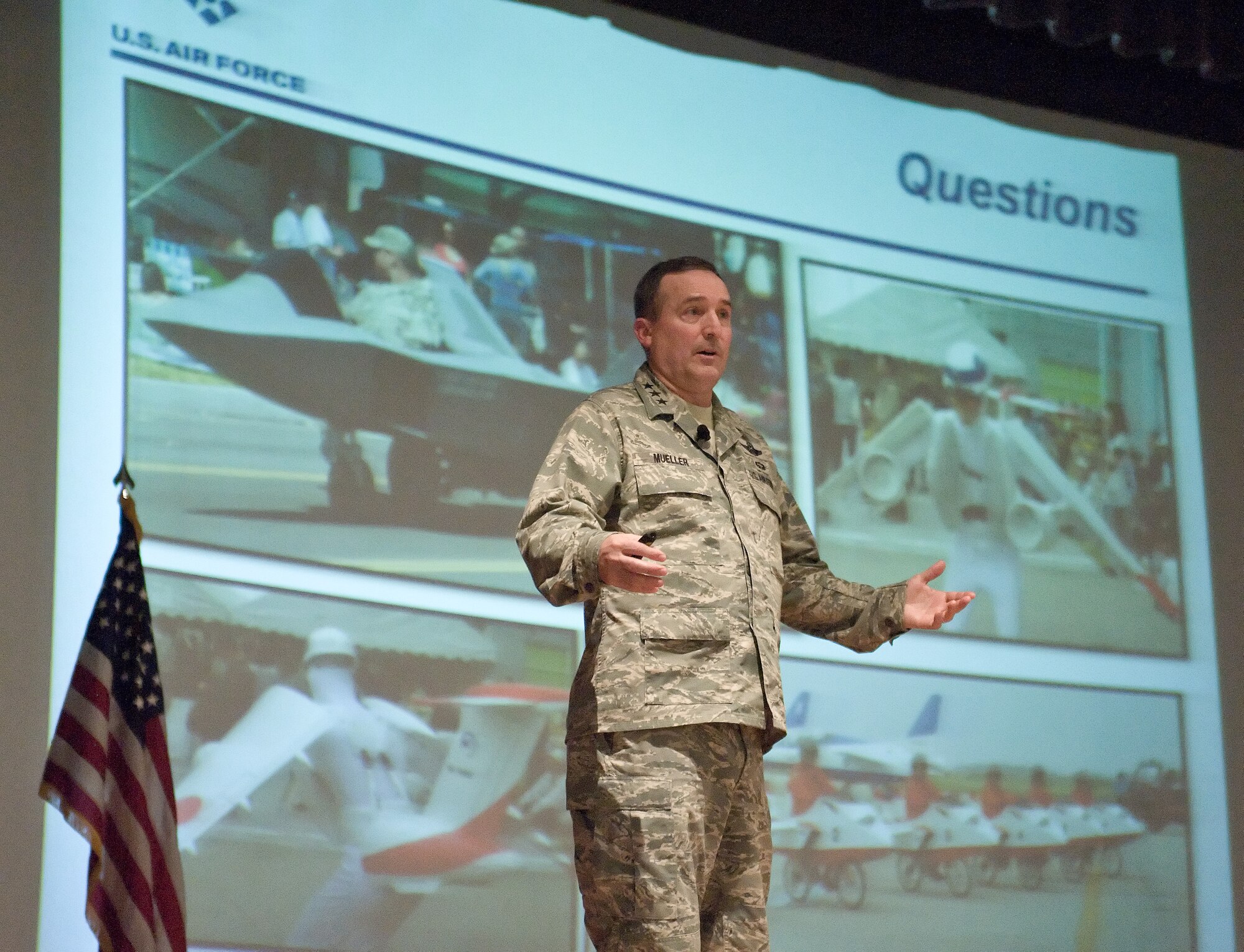 Lt. Gen. Stephen Mueller, Secretary of the Air Force Inspector General takes questions from Team Dover members Jan. 14, 2014, at the Base Theater on Dover Air Force Base, Del. Lt. Gen. Mueller said the new inspection system will take time to mature. (U.S. Air Force photo/Roland Balik)