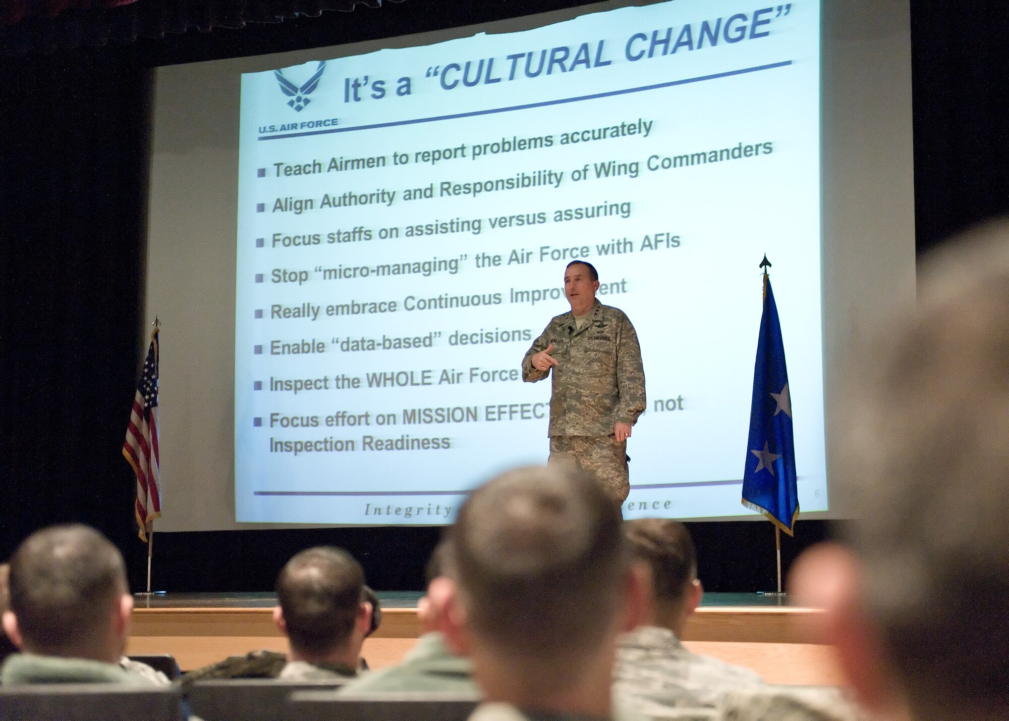 Lt. Gen. Stephen Mueller, Secretary of the Air Force Inspector General briefs Team Dover members during an all-call Jan. 14, 2014, at the Base Theater on Dover Air Force Base, Del. Lt. Gen. Mueller stated his main focus is to bring a culture of change to the Air Force inspection system. (U.S. Air Force photo/Roland Balik)
