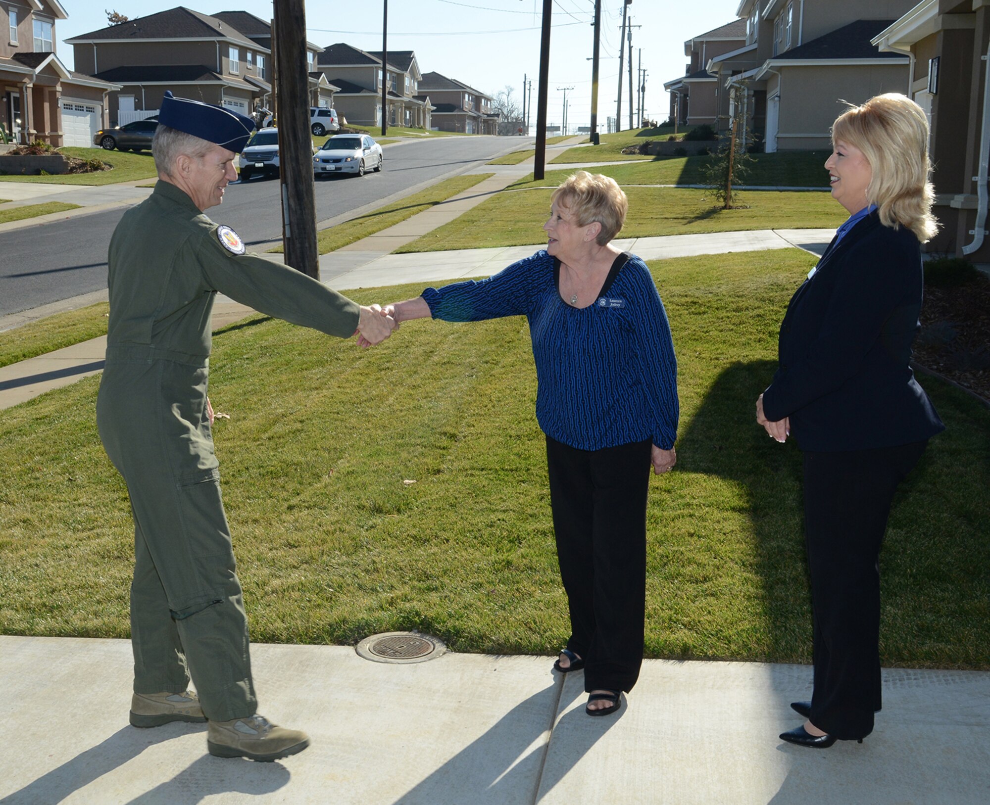 Gen. Mike Hostage, commander of Air Combat Command, meets with Laureen Jodrey, housing program manager, during a visit to Beale Air Force Base, Calif., Jan. 14, 2014. Hostage toured a newly completed single-family home. (U.S. Air Force photo by John Schwab)