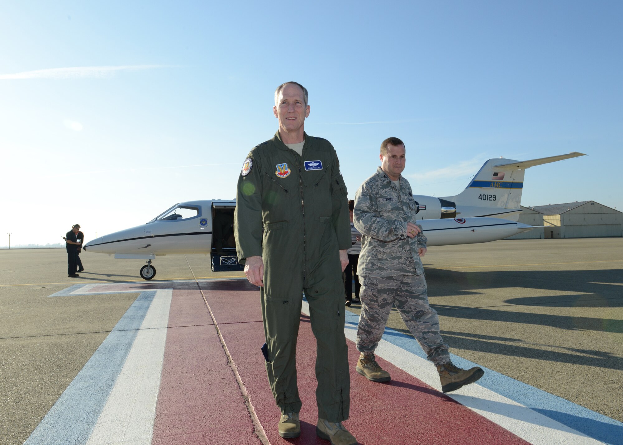 Gen. Mike Hostage, commander of Air Combat Command, walks with Col. Phil Stewart, 9th Reconnaissance Wing commander, during a visit to Beale Air Force Base, Calif., Jan. 14, 2014. Hostage met with Beale Airmen to discuss Air Force issues and concerns. (U.S. Air Force photo by John Schwab)