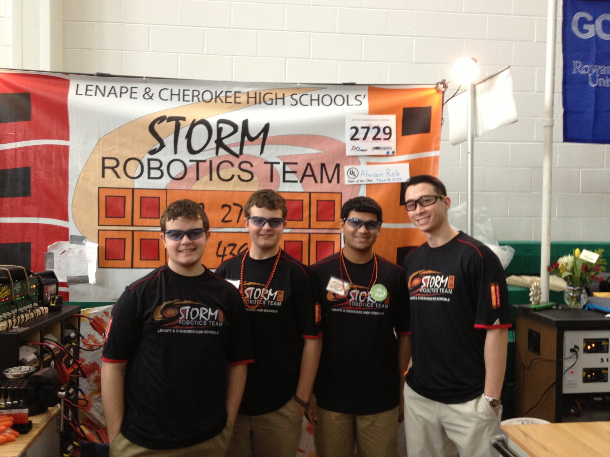 NAWCAD Lakehurst engineer Dr. James Hing (R) with the “Storm” Robotics Team members (L-R) Ryan McCarthy, Alex McCarthy and Ahasan Rob from Lenape and Cherokee High Schools in Burlington County, N.J..(U.S. Navy photo by Thomas Worsdale/Released)