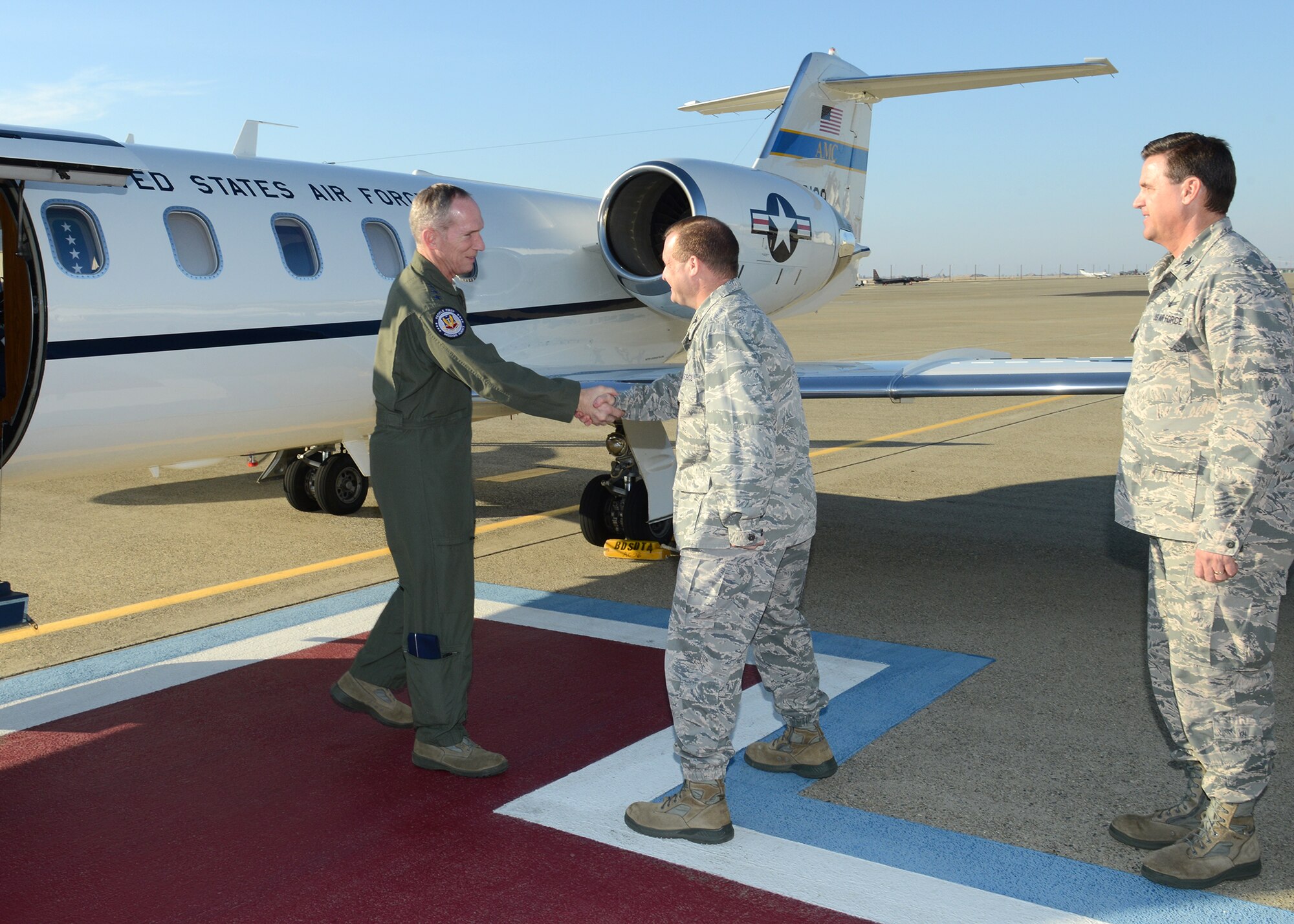 Gen. Mike Hostage, commander of Air Combat Command, greets Col. Phil Stewart, 9th Reconnaissance Wing commander, during a visit to Beale Air Force Base, Calif., Jan. 14, 2014. Hostage toured Beale and held a Q&A during an Airmen’s call. (U.S. Air Force photo by John Schwab)