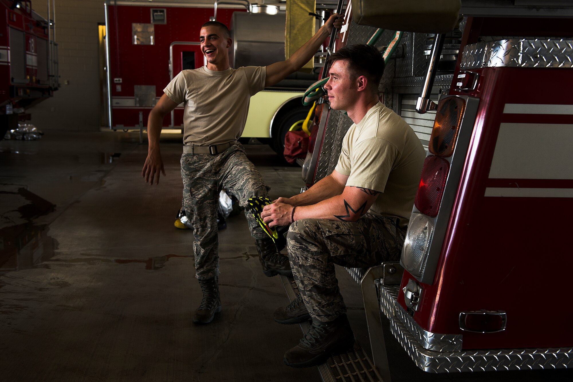 Airman First Class Joseph Minnick and Senior Airman Shaughn Bader, 19th Airlift Wing firefighters, enjoy some down time, Aug. 12, 2013, at Little Rock Air Force Base, Ark. The department, comprised of 49 Airmen and seven civilians, operates on two 24-hour shifts that respond to nearly 700 emergency calls each year. (U.S. Air Force photo by Tech. Sgt. Russ Scalf)