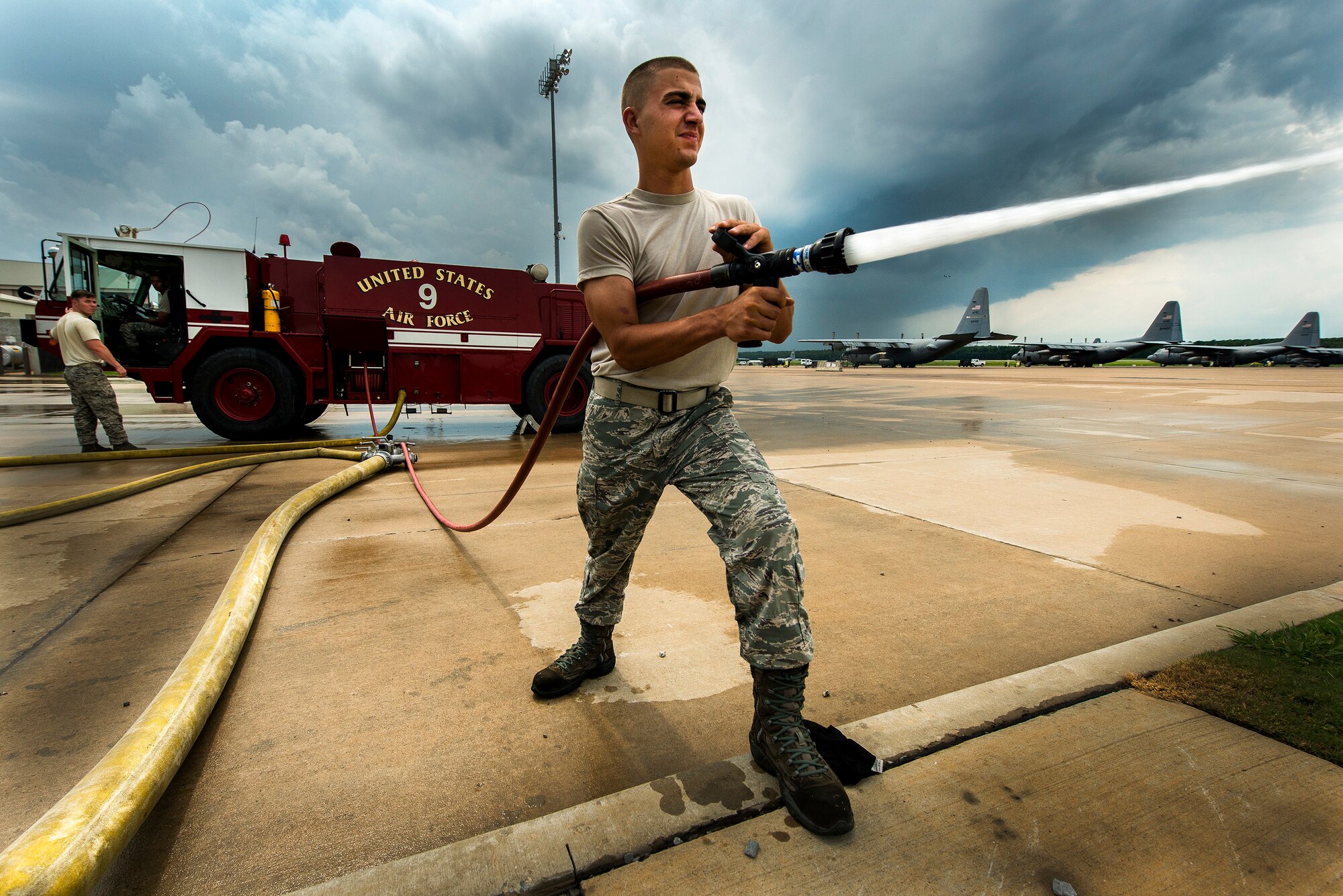 Airman First Class Joseph Minnick, a 19th Airlift Wing fire fighter practices his hose evolutions skills, Aug. 12, 2013, at Little Rock Air Force Base, Ark. The department, comprised of 49 Airmen and seven civilians, operates on two 24-hour shifts that respond to nearly 700 emergency calls each year. (U.S. Air Force photo by Tech. Sgt. Russ Scalf)