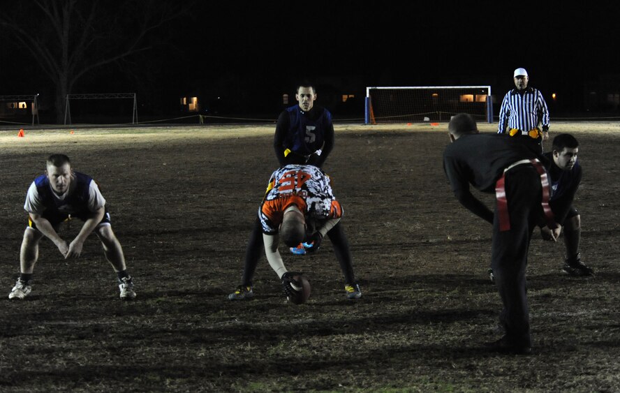 Airman 1st Class Andrew Atwater, 2nd Security Forces Squadron quarterback, waits for the snap during the intramural flag football championship on Barksdale Air Force Base, La., Jan. 13, 2014. The 2nd SFS defeated the 2nd Aircraft Maintenance Squadron in a two game series to win the title. (U.S. Air Force photo/ Staff Sgt. Sean Martin)