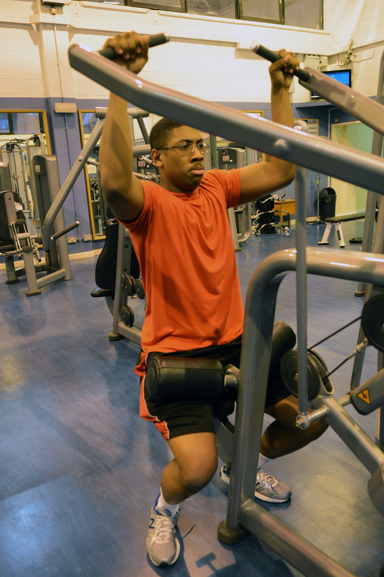 U.S. Air Force Senior Airman Shuntarrius Funchess, 100th Force Support Squadron fitness specialist from Dallas, Ga., works out Jan. 14, 2014, in the Northside Fitness Center on RAF Mildenhall, England. The fitness center partially reopened in December 2013, which helps Team Mildenhall members stay “fit to fight.” (U.S. Air Force photo by Airman 1st Class Kyla Gifford/Released)