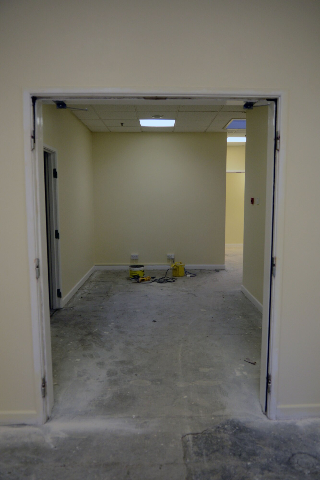 Contractors renovate a hallway in the Northside Fitness Center Nov. 4, 2013, on RAF Mildenhall, England. The fitness center, which partially reopened December 2013, will have a grand reopening Monday, Feb. 3, 2014. (U.S. Air Force photo by Airman 1st Class Kyla Gifford/Released)