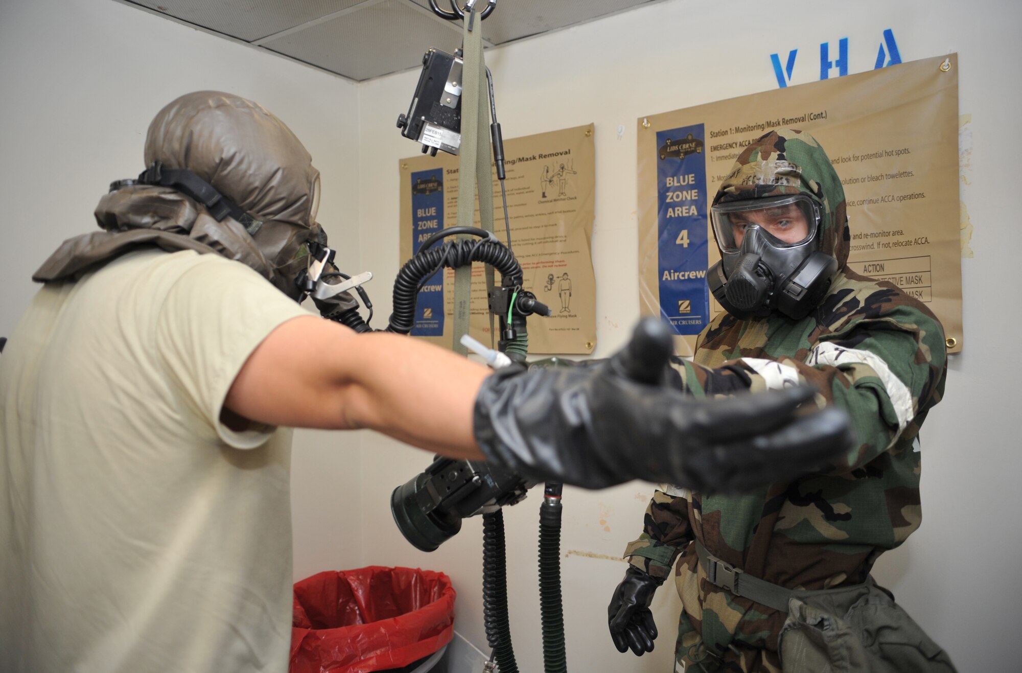 A member of the 51st Operations Support Squadron Aircrew Flight Equipment section uses a joint chemical agent detector to screen Capt. William Yoakley, A-10 Thunderbolt II pilot, for any simulated chemical, biological, radiological or nuclear contaminants during Operational Readiness Exercise Beverly Midnight 14-01 at Osan Air Base, Republic of Korea, Jan. 15, 2014. Yoakley’s aircraft was “contaminated” in the scenario, and this was the last step before he was permitted to remove his gas mask and simulate a shower in order to enter the squadron. (U.S. Air Force photo/Airman 1st Class Ashley J. Thum)