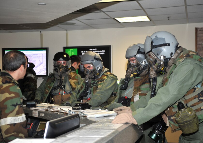 A-10 Thunderbolt II pilots from the 25th Fighter Squadron receive a mock pre-mission brief during Operational Readiness Exercise Beverly Midnight 14-01 at Osan Air Base, Republic of Korea, Jan. 15, 2014. Pilots are given similar briefs prior to real-world contingencies in order to prepare for them for things such as weather conditions and to remind them of their objective. (U.S. Air Force photo/Airman 1st Class Ashley J. Thum)