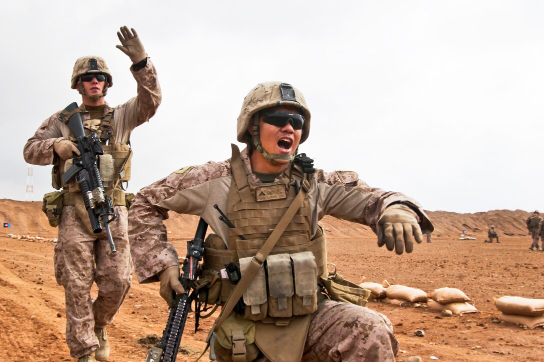 U.S. Marine Corps Cpl. Jason Tutchtone, left, and Lance Cpl. Byronalex Constantino conduct drills based on the rules of engagement on Camp Leatherneck in Afghanistan's Helmand province, Jan. 9, 2014. 