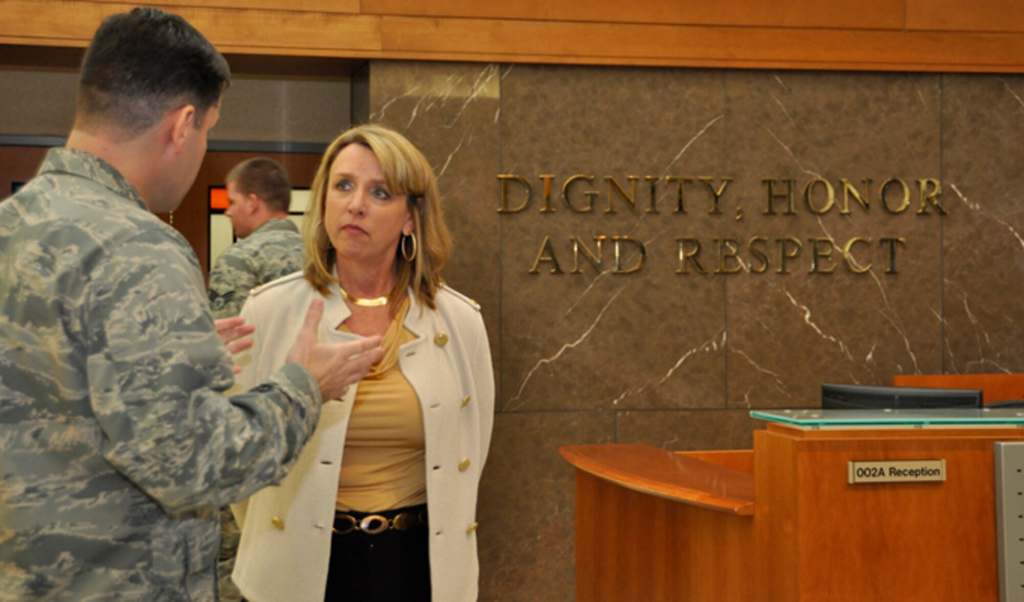 Col. John M. Devillier (left), welcomes Secretary of the Air Force Deborah Lee James to the atrium of the Charles C. Carson Center for Mortuary Affairs, Jan. 10, 2014, at Dover Air Force Base, Del. James toured the mortuary, the Center for Families of the Fallen and the Fisher House for Families of the Fallen. Devillier is the Air Force Mortuary Affairs Operations commander. (U.S. Air Force photo/Senior Airman Laura Beckley)