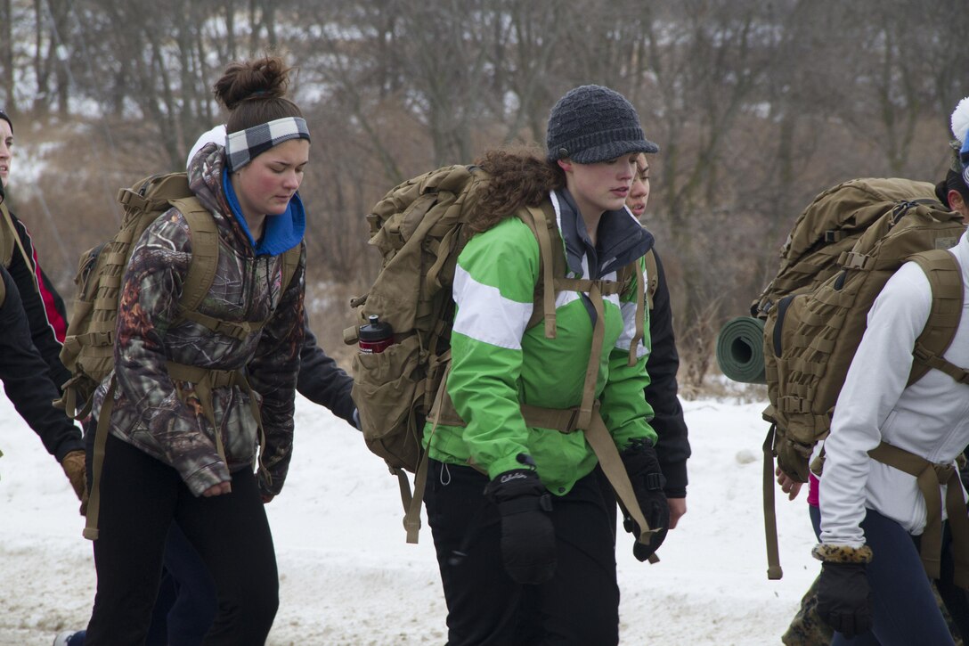 Recruiting Station Milwaukee’s female poolees test their endurance with a four mile training hike in Madison, Wis., Jan. 4, 2014. This annual pool function gives female poolees a rare chance to interact with female Marines and other poolees from around the state before recruit training.