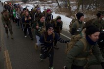 Recruiting Station Milwaukee’s female poolees test their endurance with a four mile training hike in Madison, Wis., Jan. 4, 2014. This annual pool function gives female poolees a rare chance to interact with female Marines and other poolees from around the state before recruit training.