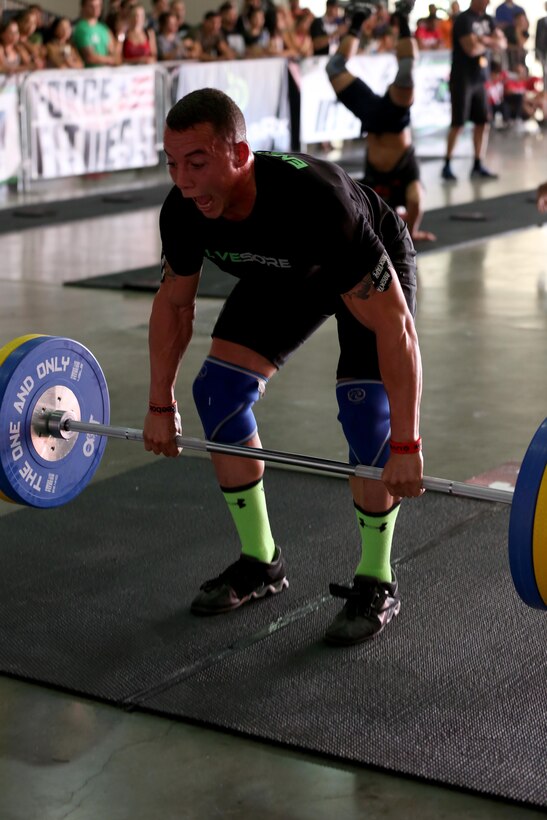 Sgt. Aaron Gardner, training clerk with Headquarters and Headquarters Squadron, Marine Corps Air Station Miramar, Calif., performs a squat clean during the second day of the Orange County Throwdown at the Orange County Fair Grounds, Jan. 11. Gardner dedicated himself to the sport he loves and trained for hours a day to compete against athletes who had either been to the CrossFit Games, or to regional qualifiers – CrossFit’s equivalent to the Super Bowl.