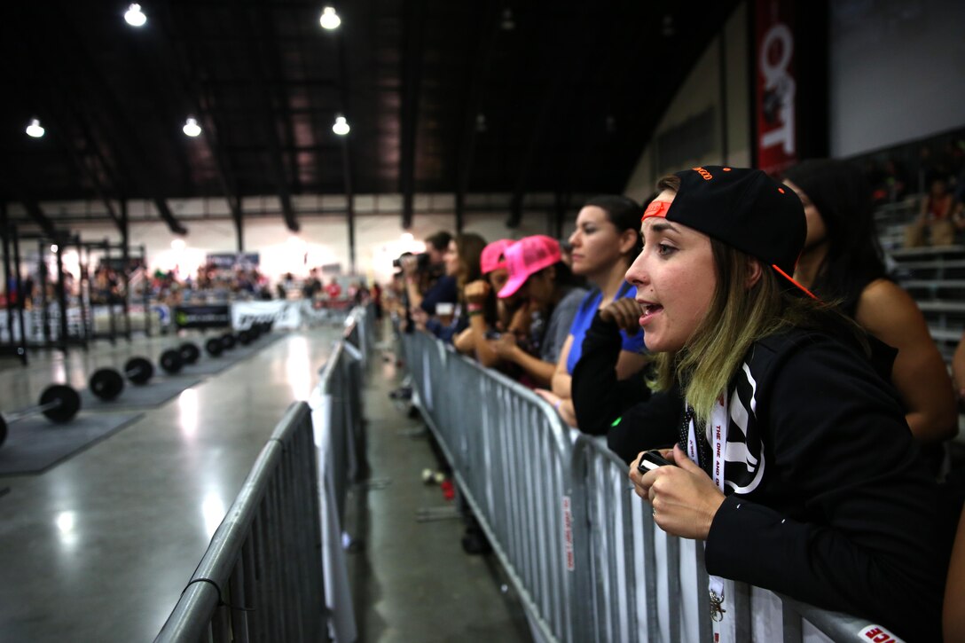 Alyxandra Gardner, wife and coach for Sgt. Aaron Gardner, training clerk with Headquarters and Headquarters Squadron, Marine Corps Air Station Miramar, Calif., cheers for her husband during Orange County Throwdown at the Orange County Fair Grounds, Jan. 11. Gardner admitted he wouldn’t be where he was at the competition without the help of his family and friends who pushed him and gave him the encouragement he needed to prepare for the CrossFit competition.