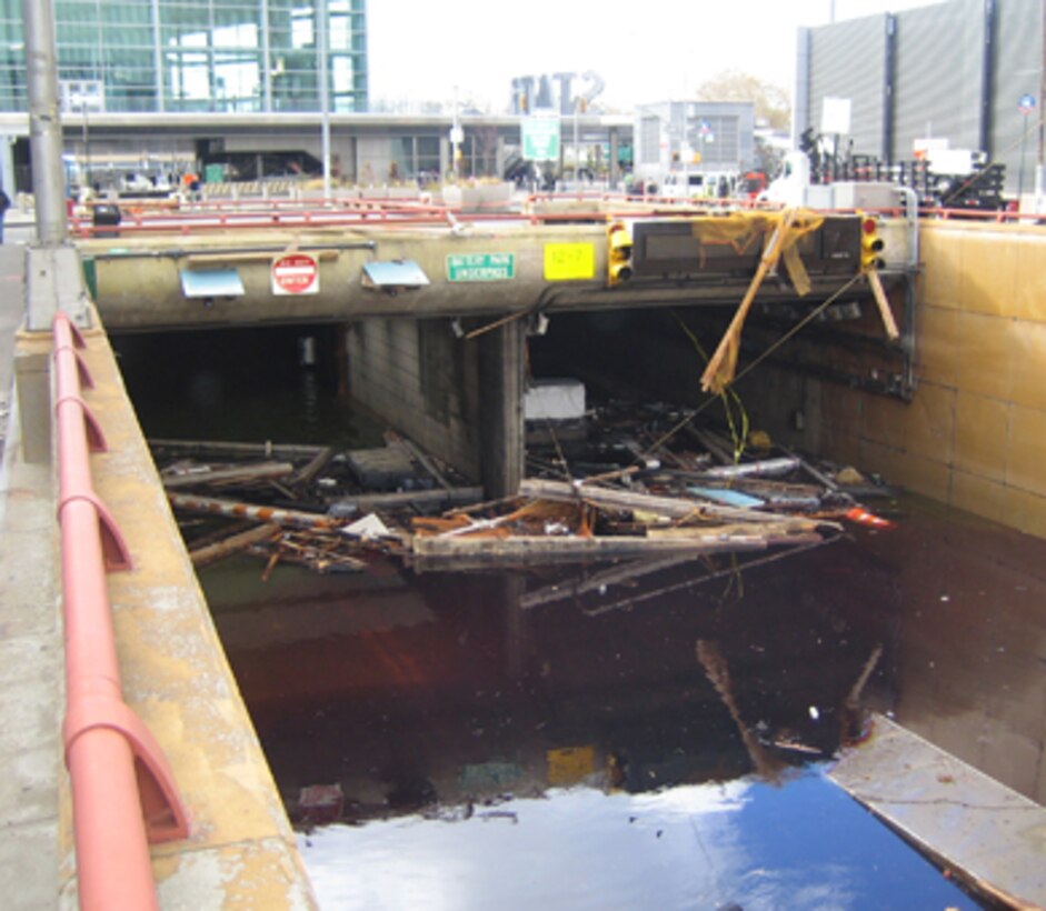 Debris floats in the tunnel opening of New York City's Battery Park Underpass following Hurricane Sandy in October 2012. This photo was taken after the unwatering team had lowered the water by about 10 feet.