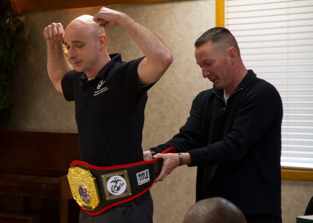 Gunnery Sgt. Shawn Campbell, SNCOIC of Recruiting Substation South Milwaukee, receives the Championship Belt for RS Milwaukee’s SNCOIC of the Year, Jan. 10, 2014.
