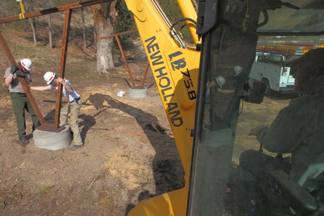 Lake staff add one of six new shade structures eventually installed at Robie Creek Park, Lucky Peak Lake.