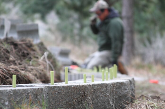 A volunteer constructs a retaining wall for a tent site at Macks Creek Park, Lucky Peak Lake.