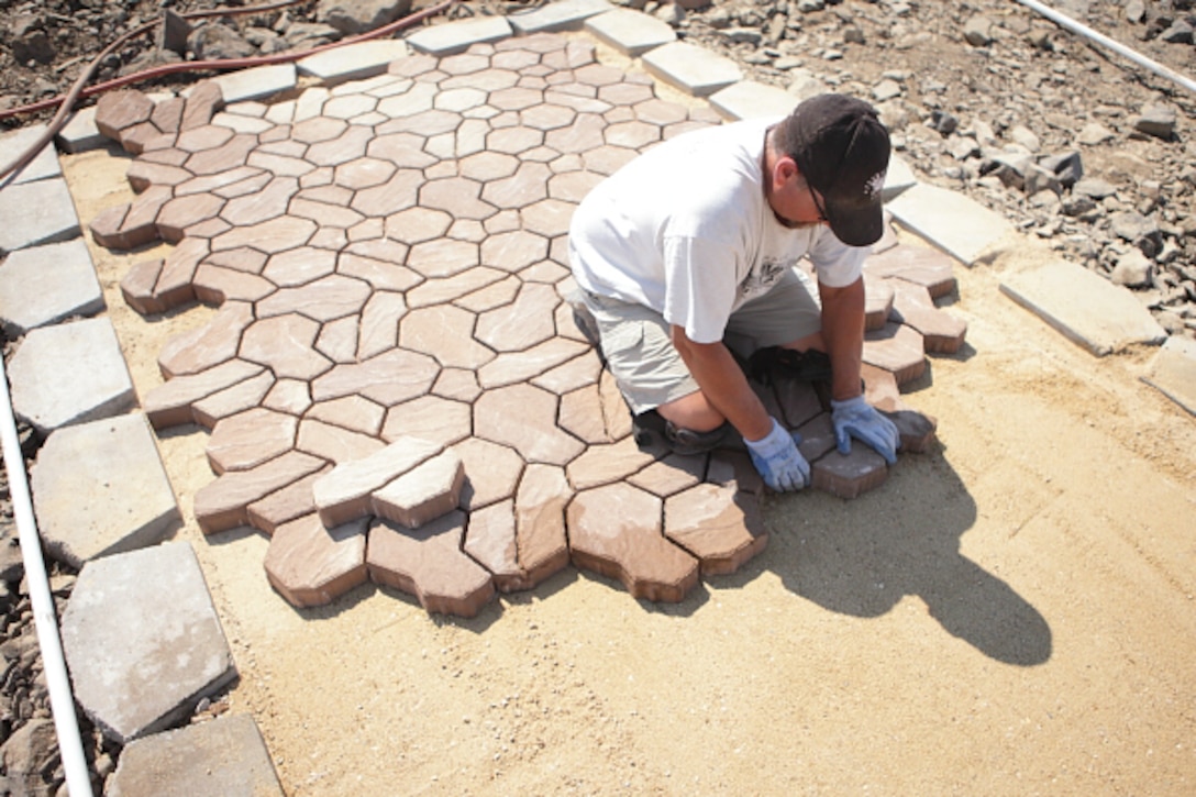 A volunteer constructing a disc golf tee pad at Lucky Peak Lake’s Lydle Gulch disc golf area.