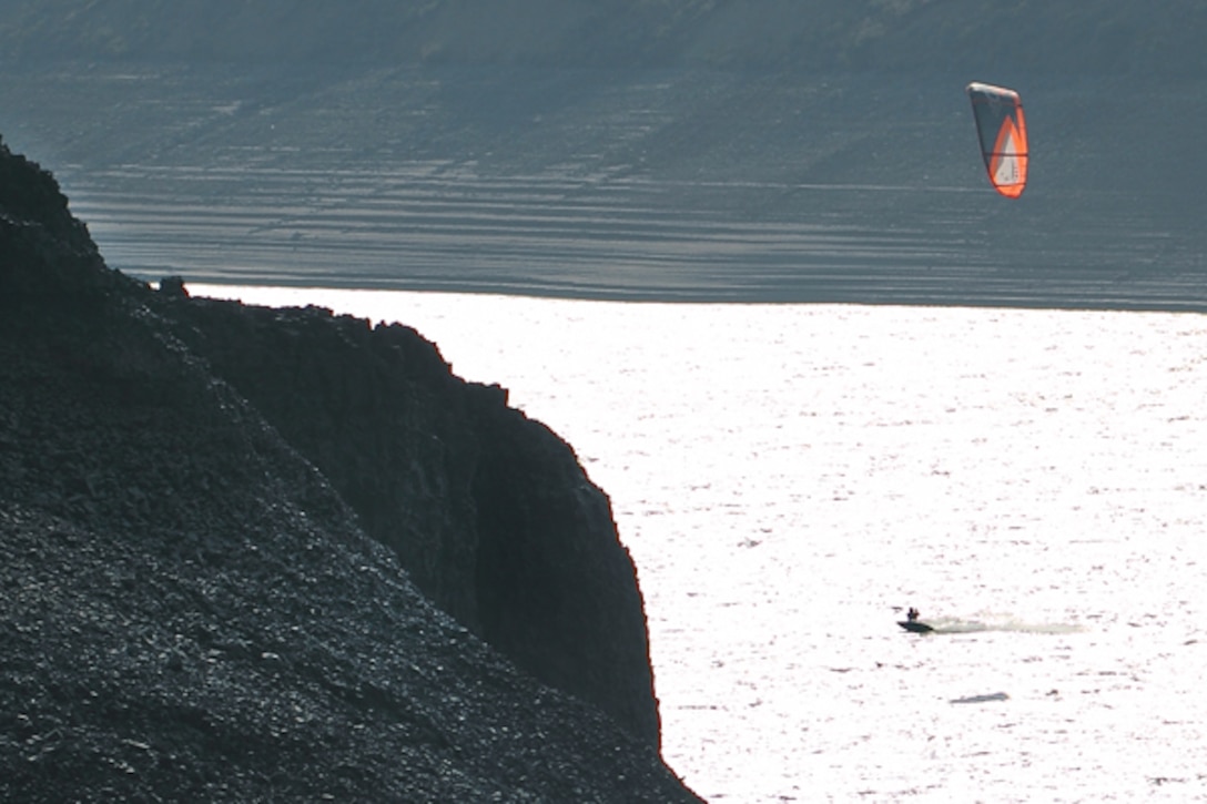 A kite surfers skims Lucky Peak Lake near Viewpoint in early fall.