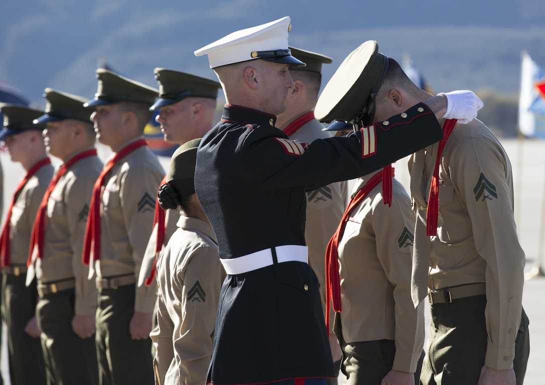 Corporals with Marine Light Attack Helicopter Training Squadron 303 receive their blood stripes during a Blood Stripe Ceremony aboard Marine Corps Air Station Camp Pendleton, Calif., Jan. 17. Marines are not entitled to wear the traditional blood stripe until they reach the rank of corporal, signifying their status as a noncommissioned officer.