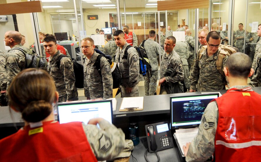 Approximately 350 Ellsworth Airmen processed through a mobility line prior to departing for  a six-month deployment to Southwest Asia in the Deployment Center at Ellsworth Air Force Base, S.D., Jan. 17, 2014. Ellsworth aircrews will conduct B-1 bomber missions designed to rapidly deliver massive quantities of precision and non-precision weapons against adversaries. (U.S. Air Force photo by Senior Airman Anania Tekurio/Released)