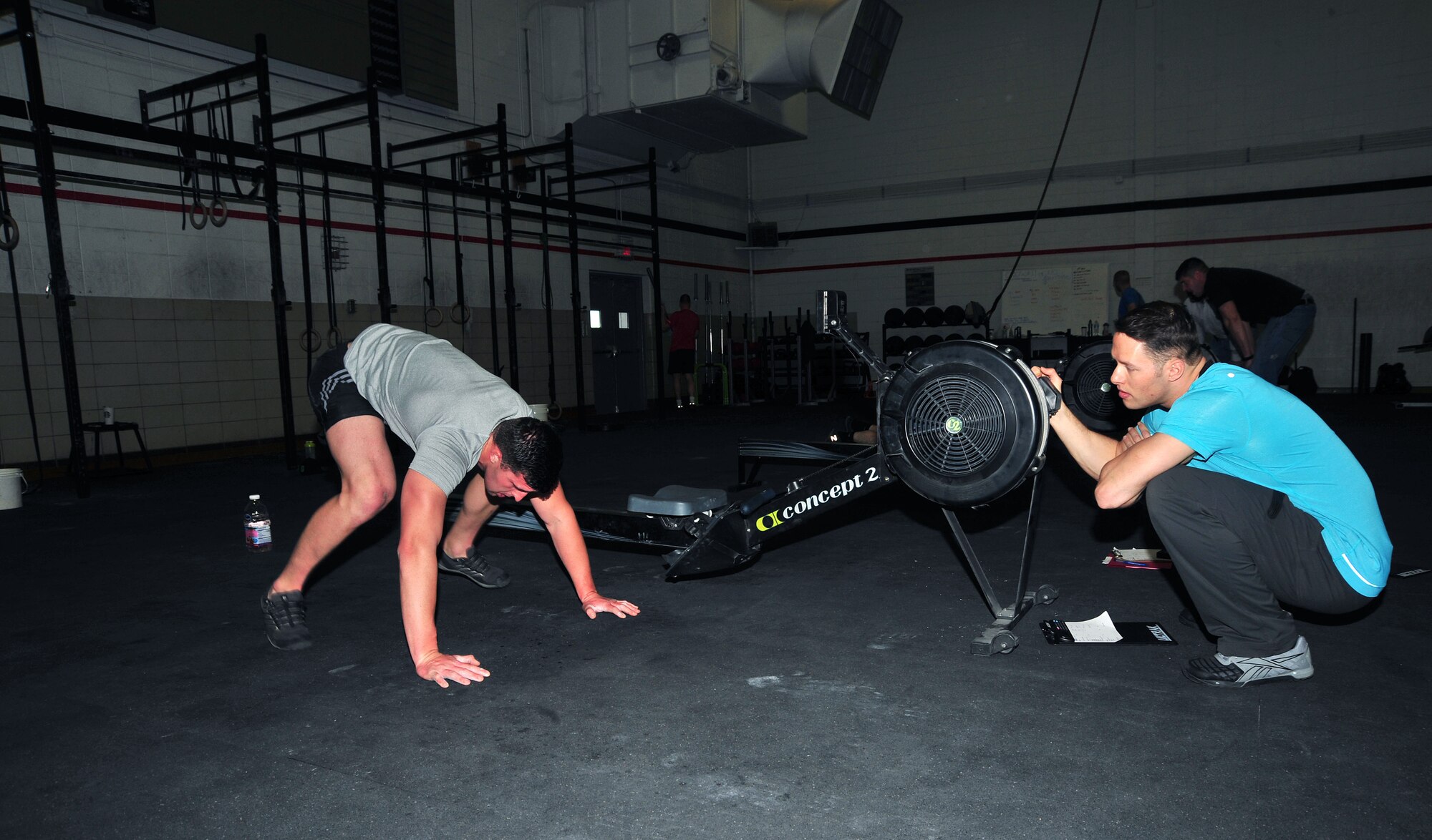 U.S. Air Force Airman 1st class Andrew Swan, 355th Logistics Readiness Squadron, performs a burpee during a fitness challenge at Davis-Monthan Air Force Base, Ariz., Jan. 17, 2014. Swan was one of the nine competitors that participated in the quarterly fitness challenge.(U.S. Air Force photo by Senior Airman Josh Slavin/Released)