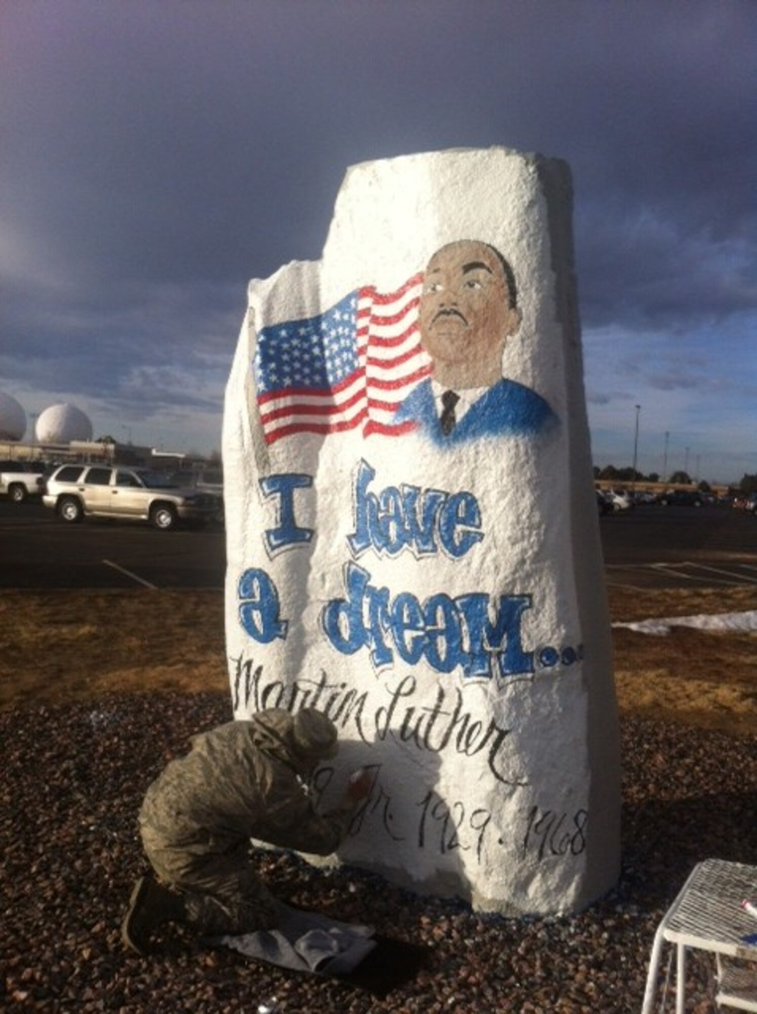 Staff Sgt. Alfonso Martinez, 460th Logistics Readiness Squadron, paints a commemorative image in honor of Dr. Martin Luther King Jr. Jan. 17, 2014, on the Spirit Rock at Buckley Air Force Base, Colo. Dr. Martin Luther King Jr. Day is a federal holiday observed on the third Monday of each January in honor of King, a key leader in civil rights movements. (Courtesy photo)  