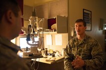 Captain Eric Noll, 5th Medical Operations Squadron optometrist, talks to a patient at Minot Air Force Base’s optometry office, Jan. 14, 2014. Noll, who arrived in August, is now offering full-service eye care at the optometry office. (U.S. Air Force photo/Airman 1st Class Apryl Hall)