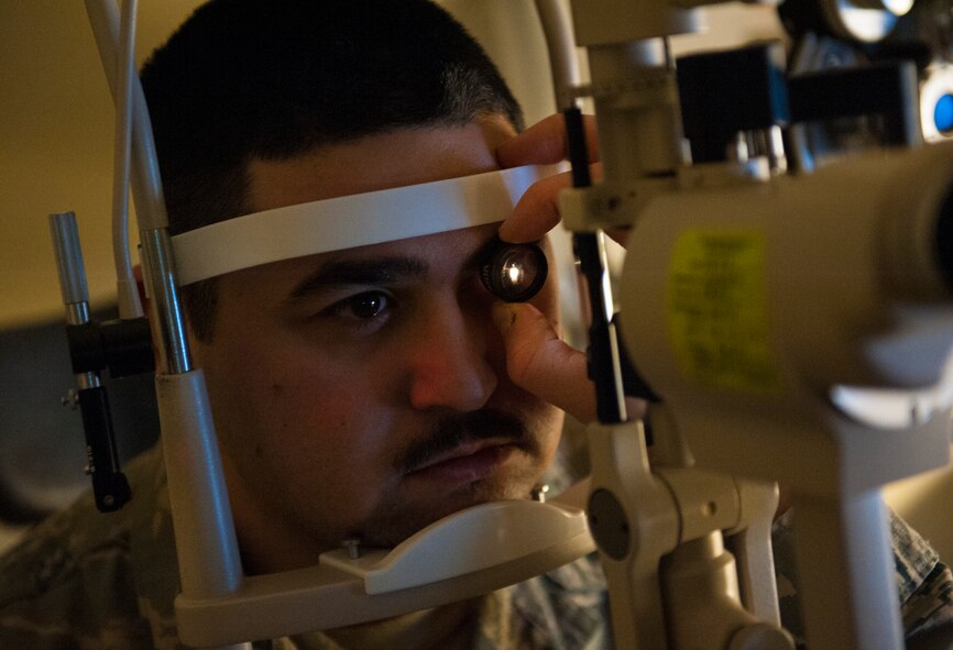 Senior Airman Ted Tanaka, 5th Maintenance Squadron crew chief, gets an eye exam at Minot Air Force Base’s optometry office, Jan. 14, 2014. With the 5th Medical Operations Squadron’s new optometrist Capt. Eric Noll, who arrived in August, the office has returned to normal, full-service eye care. (U.S. Air Force photo/Airman 1st Class Apryl Hall)