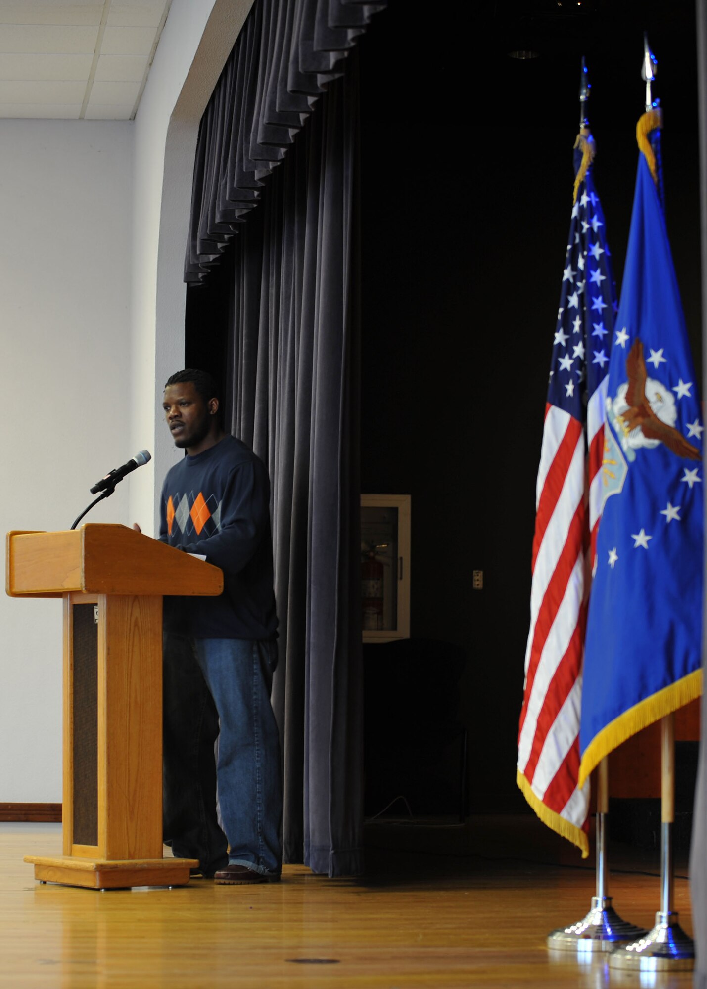 Nathaniel Morrison, Lajes Youth Center, speaks of the importance of making a difference and being a light in the world. The 65th Air Base Wing celebrated the life and achievements of Dr. Martin Luther King, Jr., with a Unity Service consisting of songs and speeches Jan.17, 2014. The event featured service members of various backgrounds discussing how Martin Luther King's civil rights efforts affected their cultures. Martin Luther King Day is observed the third Monday in January of each year. The annual theme is "A Day On, Not a Day Off." (U.S. Air Force photo by Staff Sgt. Angelique N. Smythe)