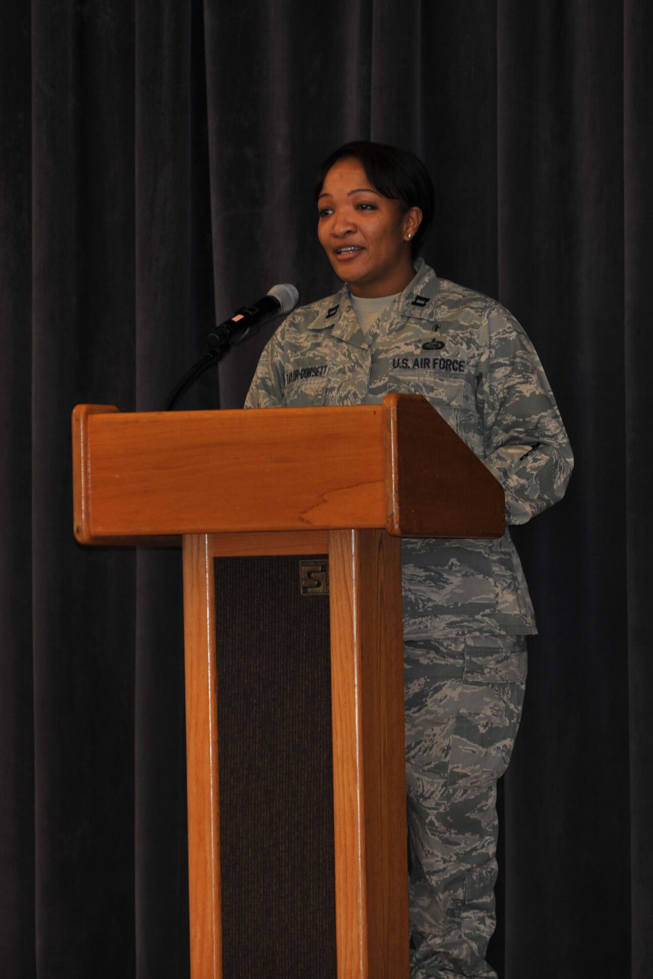 Capt. Gillian Taylor-Dorsett, 65th Medical Support Squadron, speaks of the opportunities she's been afforded as a Caribbean native due to the efforts of Dr. Martin Luther King, Jr.  The 65th Air Base Wing celebrated the life and achievements of Dr. Martin Luther King, Jr., with a Unity Service consisting of songs and speeches Jan.17, 2014. The event featured service members of various backgrounds discussing how Martin Luther King's civil rights efforts affected their cultures. Martin Luther King Day is observed the third Monday in January of each year. The annual theme is "A Day On, Not a Day Off." (U.S. Air Force photo by Staff Sgt. Angelique N. Smythe)