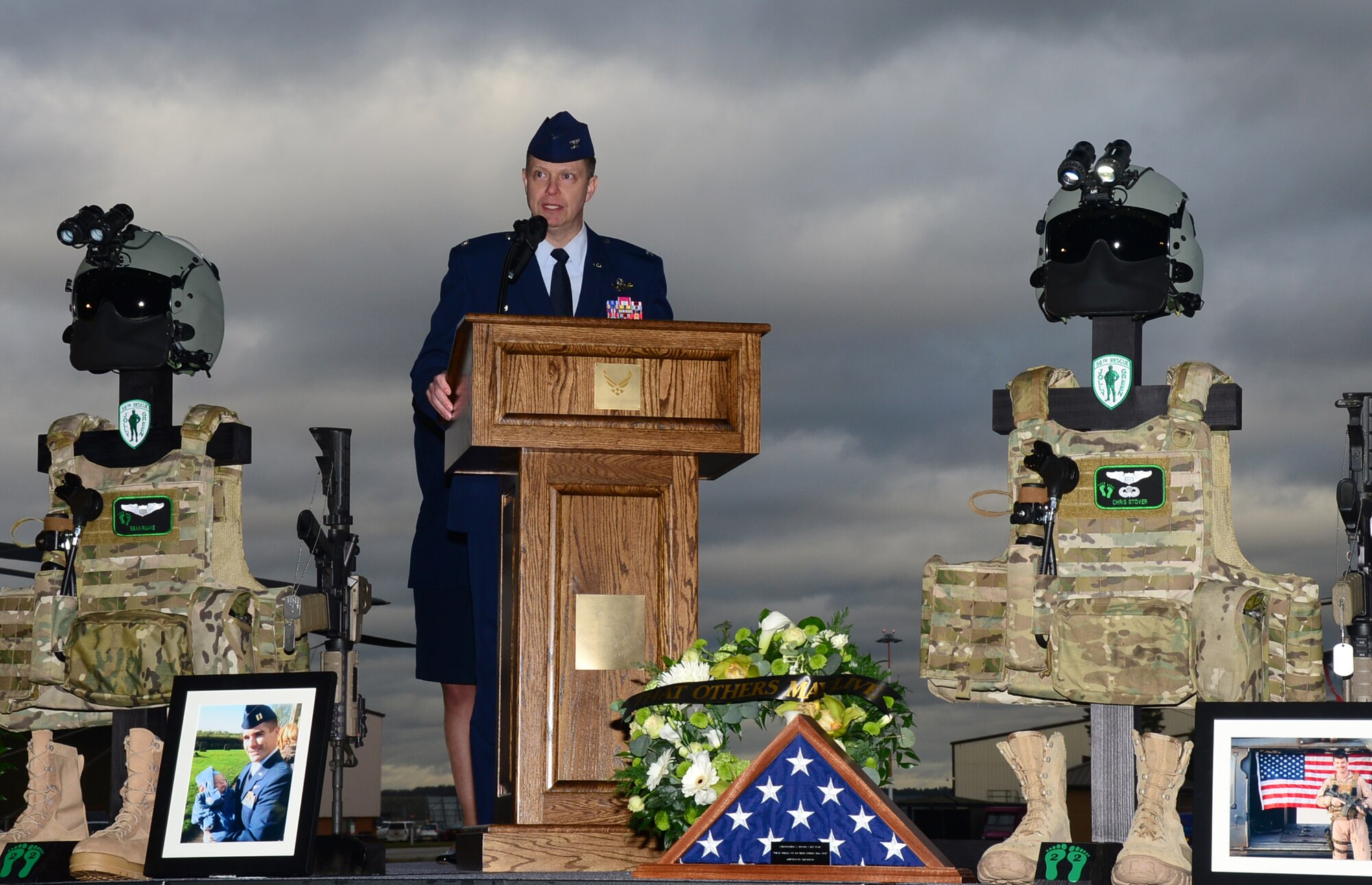 Col. Kyle Robinson, 48th Fighter Wing commander, gives comments during a memorial service to honor four fallen Airmen on Jan. 17, 2014 at Royal Air Force Lakenheath, United Kingdom. The memorial service was held to honor Capt. Sean Ruane, Capt. Christopher Stover, Tech. Sgt. Dale Mathews and Staff Sgt. Afton Ponce, 56th Rescue Squadron, who were killed during an HH-60G Pave Hawk helicopter crash while performing a low-level training mission on the Norfolk coast Jan. 7, 2014. (U.S. Air Force photo by Airman 1st Class Erin O’Shea/Released)