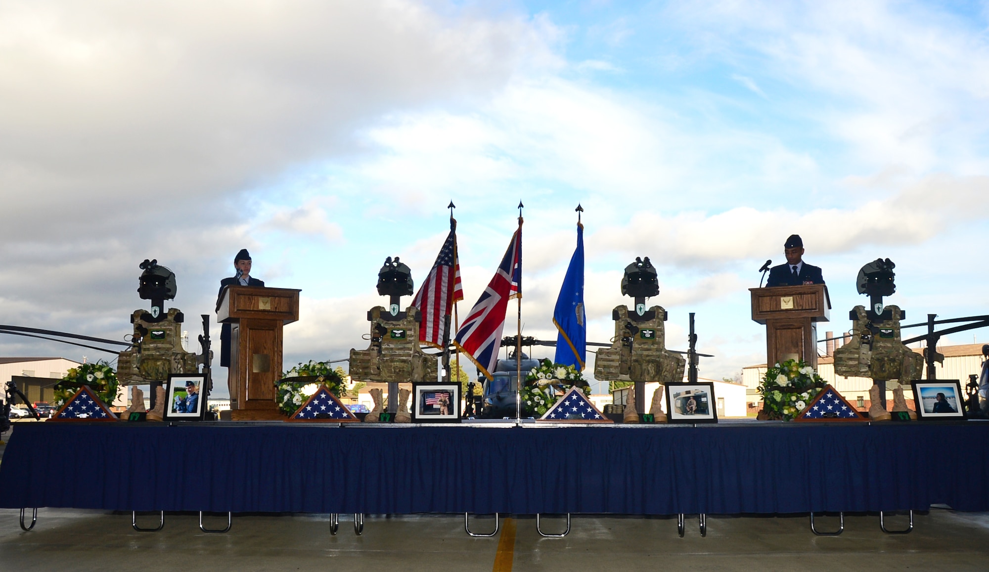 Capt. Annie Driscoll and 1Lt. Ryan Martelly, HH-60G Pave Hawk pilots, speak during a memorial service to honor four fallen Airmen on Jan. 17, 2014, at Royal Air Force Lakenheath, United Kingdom. The memorial service was held to honor Capt. Sean Ruane, Capt. Christopher Stover, Tech. Sgt. Dale Mathews and Staff Sgt. Afton Ponce, 56th Rescue Squadron, who were killed during an HH-60G Pave Hawk helicopter crash while performing a low-level training mission on the Norfolk coast  Jan. 7, 2014. (U.S. Air Force photo by Airman 1st Class Erin O’Shea/Released)