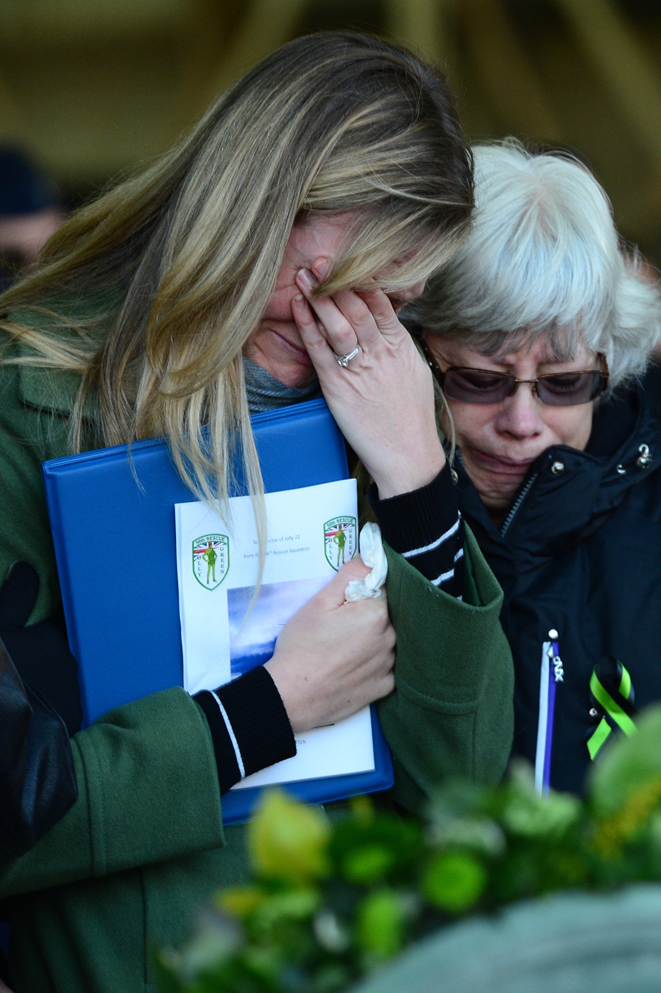 Sarah Stover, widow of Capt. Christopher Stover, 56th Rescue Squadron HH-60G Pave Hawk pilot, pays her final respects to her fallen husband at a memorial service Jan. 17, 2014. The memorial service was held to honor Capt. Sean Ruane, Capt. Christopher Stover, Tech. Sgt. Dale Mathews and Staff Sgt. Afton Ponce, 56th Rescue Squadron, who were killed during an HH-60G Pave Hawk helicopter crash while performing a low-level training mission on the Norfolk coast Jan. 7, 2014. (U.S. Air Force photo by Airman 1st Class Dana J. Butler/Released)  