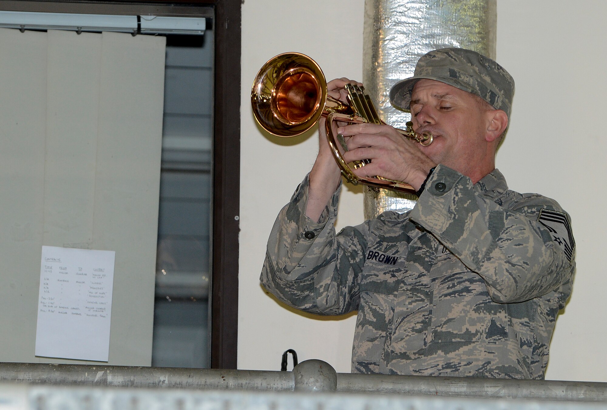 Chief Master Sgt. Richard Brown, 48th Medical Operations Squadron chief, plays Taps during a memorial service Jan. 17, 2014. The memorial service was held in honor of Capt. Sean Ruane, Capt. Christopher Stover, Tech. Sgt. Dale Mathews and Staff Sgt. Afton Ponce, 56th Rescue Squadron, who were killed in an HH-60G Pave Hawk helicopter crash while performing a low-level training mission on the Norfolk coast, Jan. 7, 2014. (U.S. Air Force photo by Airman 1st Class Trevor T. McBride/Released)
