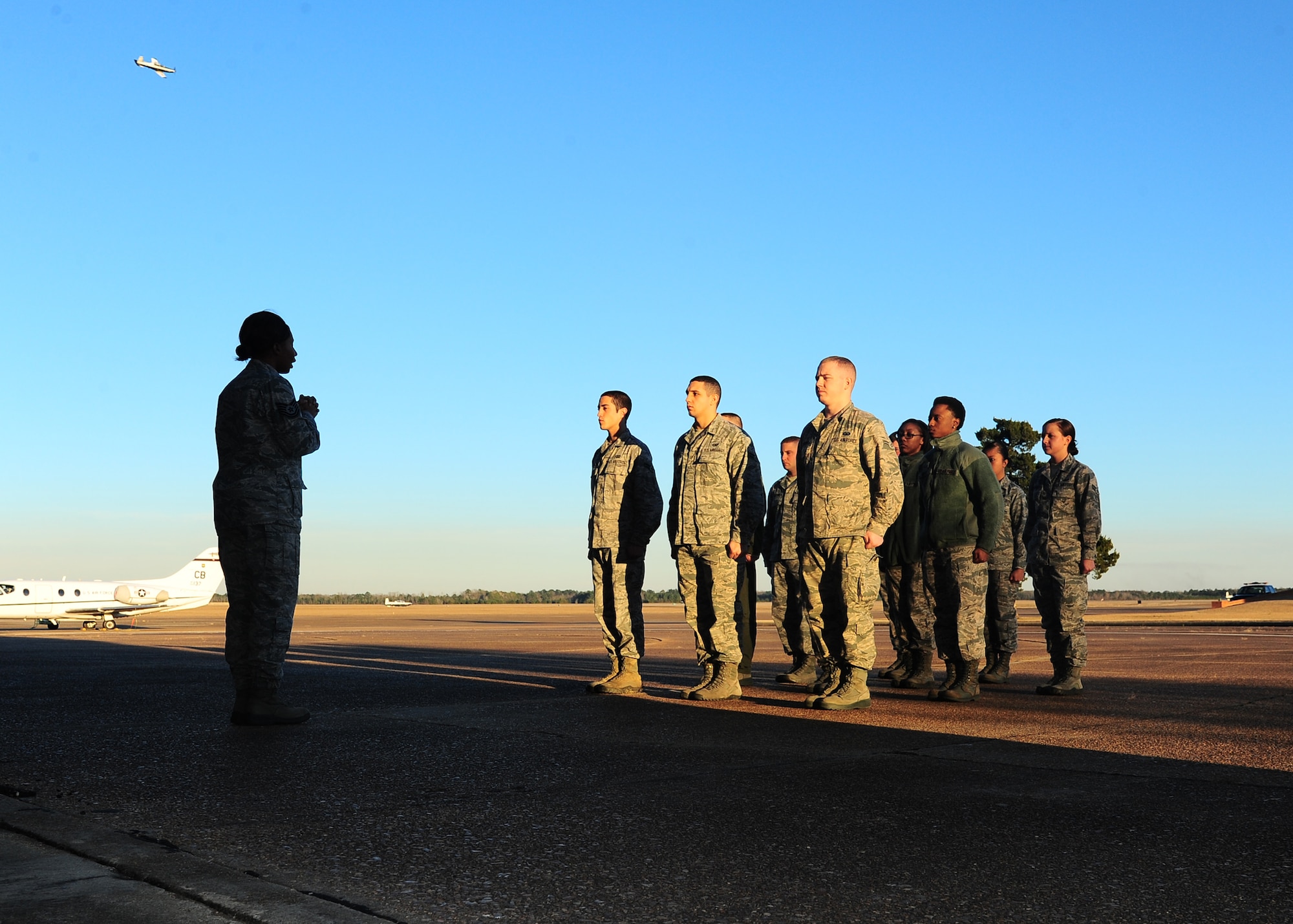 Tech Sgt. Jeri Catus, 14th Flying Training Wing Honor Guard Program Manager, talks to a formation of Airmen in the Base Honor Guard before beginning practice Dec. 18. The Honor Guard holds practice every Wednesday at the Walker Center on base. (U.S. Air Force Photo/Airman 1st Class Stephanie Englar)