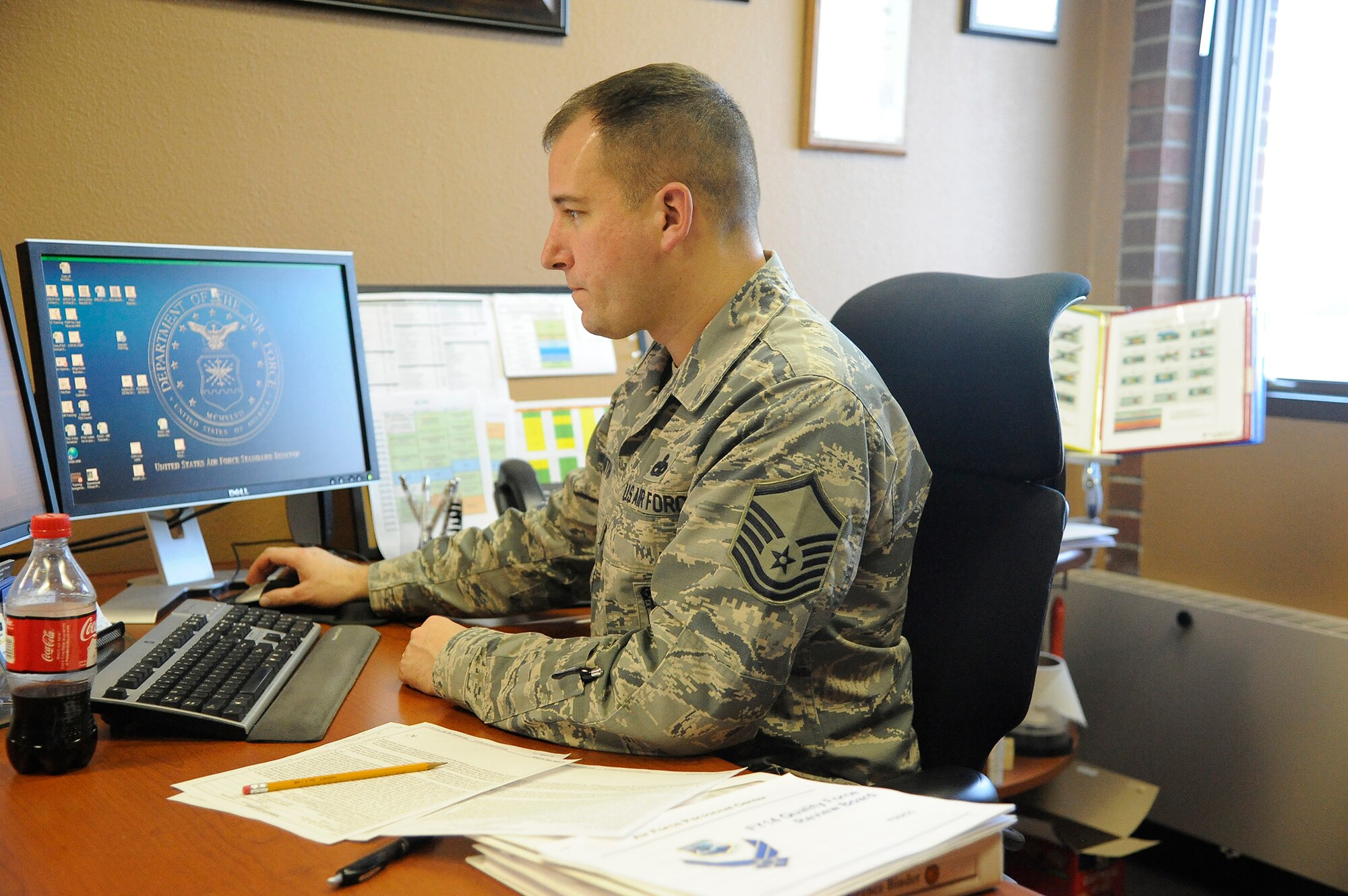 Staff Sgt. Francis Wiener, 819th RED HORSE Squadron First Term Airman Center NCO in charge (left), speaks with Susan Patrick, 341st Force Support Squadron education advisor, about how to apply military educational benefits to his degree Dec. 20. Team Malmstrom members have the option of meeting with a guidance counselor to help develop a plan to achieve their educational goals while still serving on active duty. (U.S. Air Force photo/Airman 1st Class Collin Schmidt)