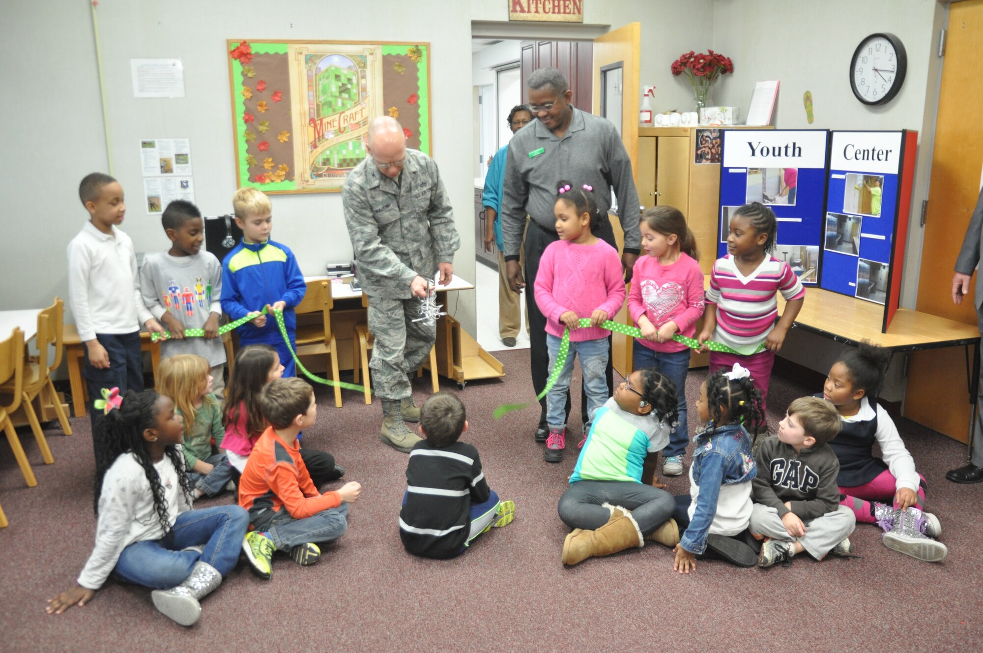 Col. Scott Vaughn, 14th Mission Support Group Commander, cuts the ribbon signaling the end of the kitchen renovations project in the Youth Center Jan. 16. The kitchen, which serves 25-60 meals a day, started renovations back in Oct. 2013. It was last renovated in 1995.
