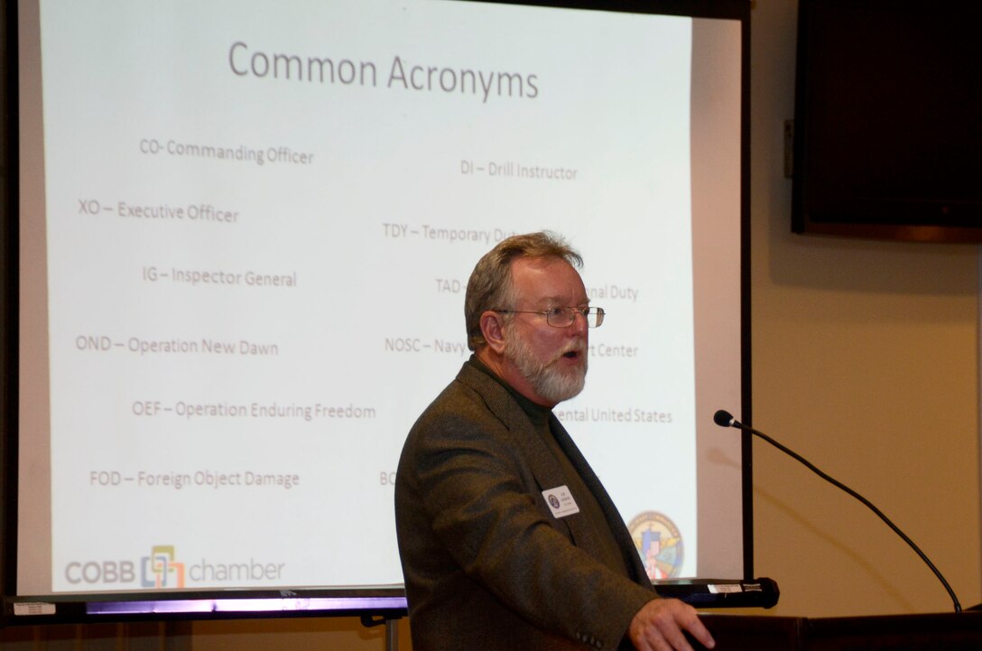 Joe Gaskin, Co-chair of the Honorary Commanders Association briefs new members of the Class of 2014 on the meaning of acronyms used by the military, during the HCA Installation Ceremony held at Dobbins Air Reserve Base, Ga., Jan. 15. (U.S. Air Force photo/Don Peek)