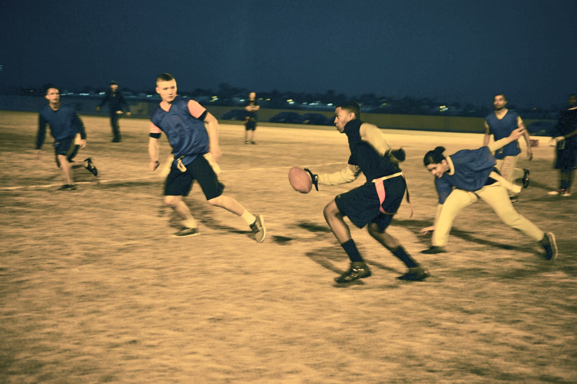 Nicholas Spivey, 56th Logistics Readiness Squadron, runs for a first down during the first half of an intramural flag football game Jan. 9 at the Luke Air Force Base football field. LRS defeated the 56th Components Maintenance Squadron team 39-0. (U.S. Air Force photo/Senior Airman David Owsianka)