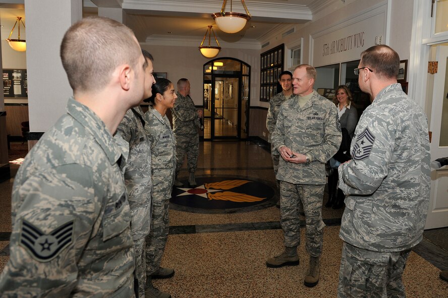 Chief Master Sgt. of the Air Force James A. Cody spends a few minutes with Airmen at Scott Air Force Base, Ill., Jan. 14, 2014. Cody coined the Airmen for excellence and discussed their family life and Air Force experiences. (U.S. Air Force photo/Staff Sgt. Jonathan Fowler)