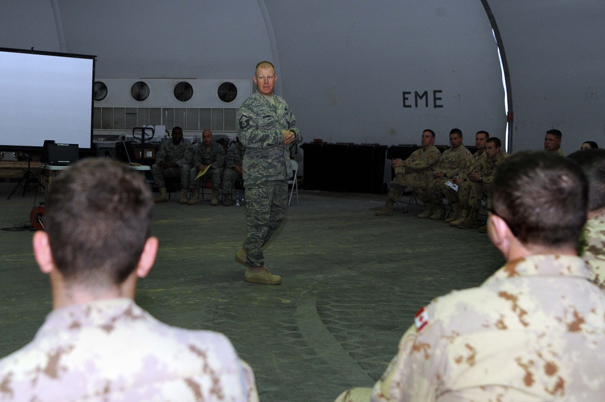 Master Sgt. Nicholas Gorham, 386th Air Expeditionary Wing antiterrorism check six team noncommissioned officer in charge, briefs the Operations Support Detachment about active shooter vigilance at Camp Canada. Gorham is deployed from Grand Forks Air Force Base, N.D. and native of San Bernardino, Calif. (U.S. Air Force photo by Senior Airman Desiree W. Moye)