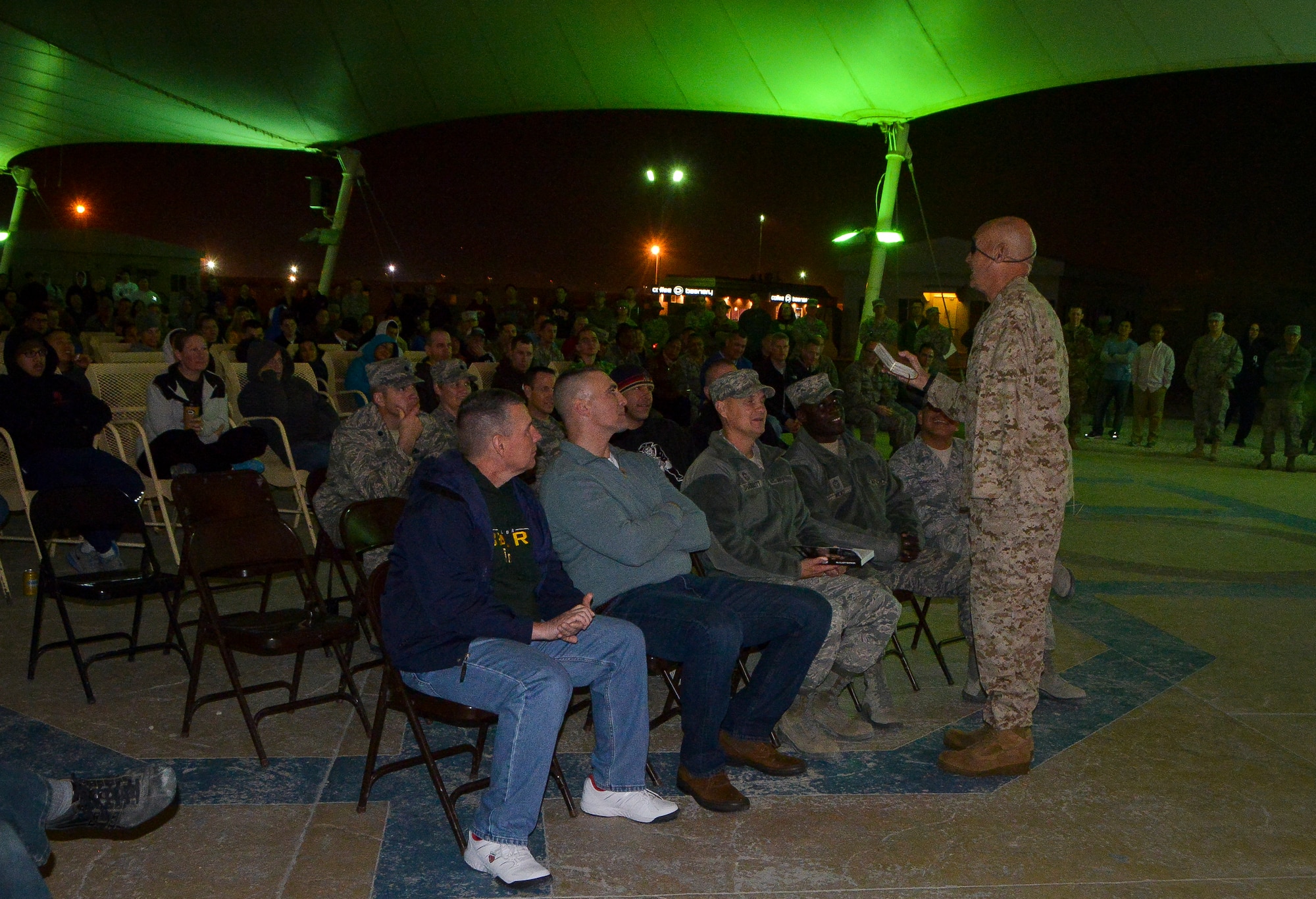 Clebe McClary, a former Marine 1st lieutenant who was wounded during the Vietnam War , shares his story with a group of  Airmen, Sailors, Marines, Soldiers and civilians at Al Udeid Air Base, Qatar, Jan. 14, 2104.   McClary survived more than 40 surgeries and overcome the mental and emotional stress of losing an eye and left arm during an enemy attack in Vietnam. Today, McClary travels around the world and shares his story with men and women of all ages. (U.S. Air Force photo/Senior Airman Jared Trimarchi)