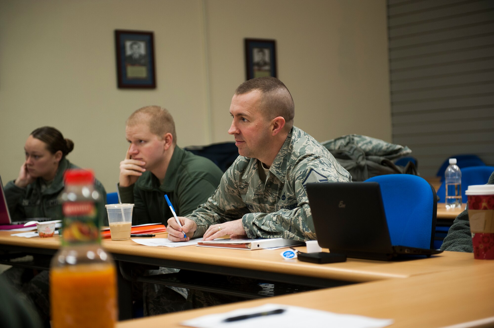 Master Sgt. Bryon Barron, 673rd Air Base Wing Airman Leadership School instructor, evaluates a student during a recent ALS class at Kunsan Air Base, Republic of Korea, Dec. 12, 2013. Barron is stationed at Joint Base Elmendorf-Richardson but came to Kunsan as a temporary duty assignment to teach ALS. These instructors ensure that Airmen continue their professional development while stationed in the Republic of Korea. (U.S. Air Force photo by Senior Airman Clayton Lenhardt/Released)