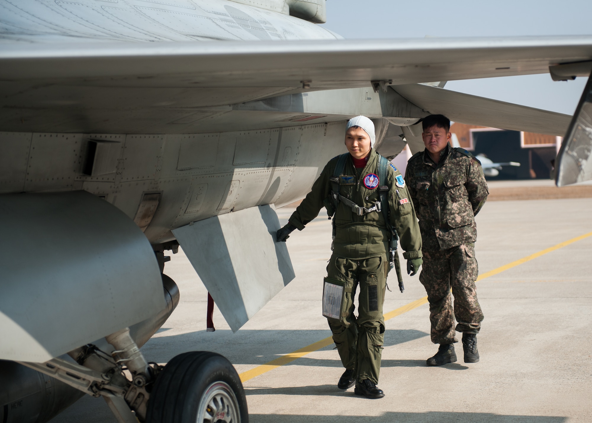 Republic of Korea air force Capt. Jun-Mong Yang, 123rd Fighter Squadron inspects his F-16K before a flight during the exercise Buddy Wing 14-1 at Kunsan Air Base, Republic of Korea, Jan 15, 2014. Buddy Wing is a combined training exercise between U. S. Air Force and Republic of Korea air force pilots to improve communication and combat capabilities to strengthen the peninsula’s combined air power team. (U.S. Air Force photo by Senior Airman Clayton Lenhardt/Released)