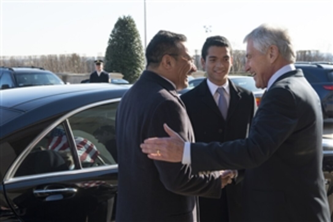 U.S. Defense Secretary Chuck Hagel, right, greets Malaysian Defense Minister Hishammuddin Tun Hussein as he arrives at the Pentagon, Jan. 17, 2014. The two defense leaders met to discuss issues of mutual importance.